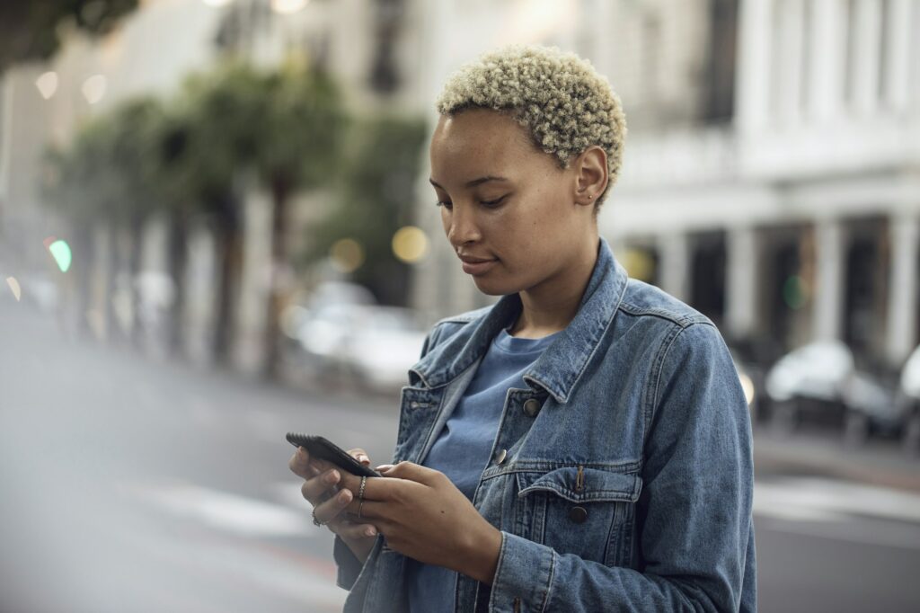 Young woman using smartphone in the city
