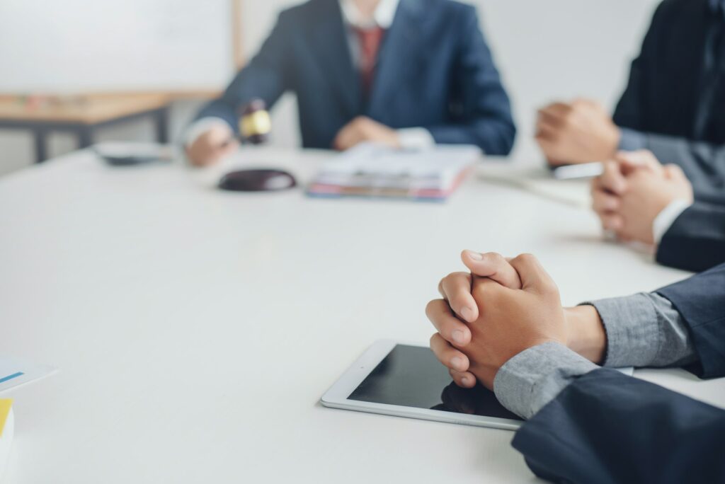 Business lawyer working about legal legislation in courtroom to help their customer.
